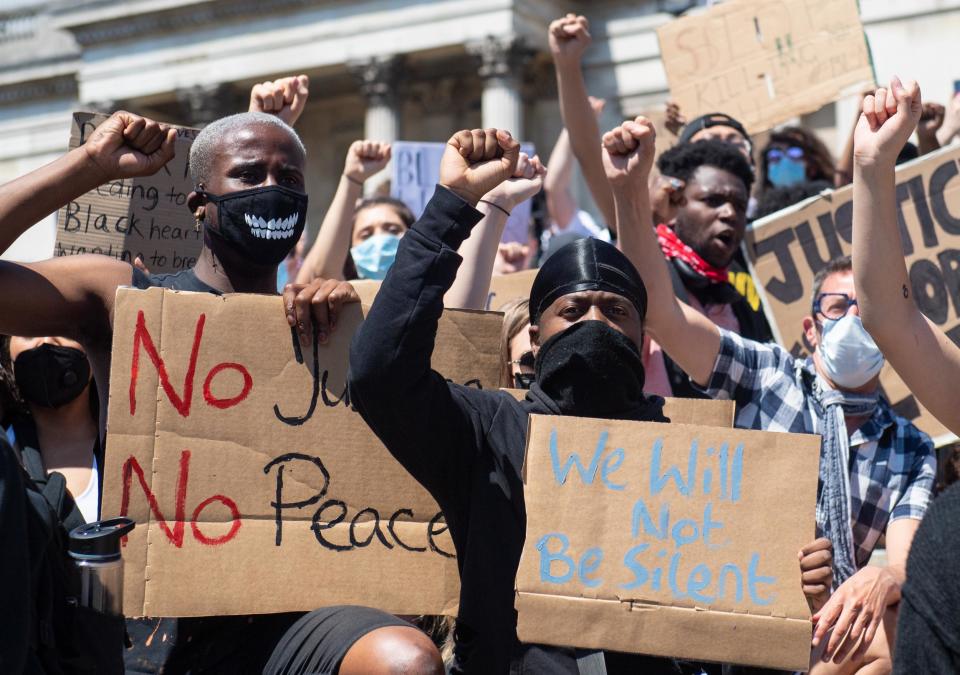 London protesters held signs reading