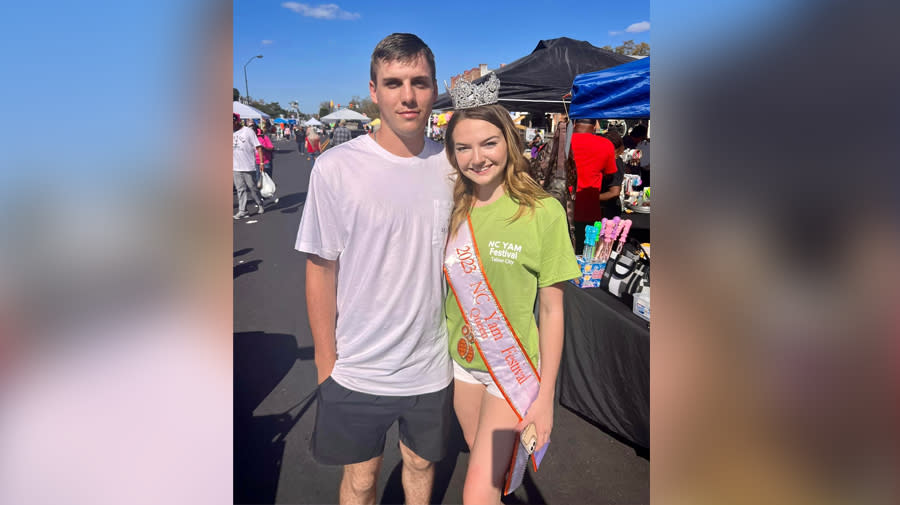 Danny Nobles Jr. (left) with the Tabor City Fire Department along with Heather Watts (right) the 2023-2024 North Carolina Yam Festival Queen at the Yam Festival event in Tabor City. Nobles died on Saturday following a car crash near Conway, South Carolina.