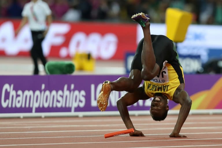 Jamaica's Usain Bolt falls after injuring himself in the final of the men's 4x100m relay at the 2017 IAAF World Championships at the London Stadium in London on August 12, 2017