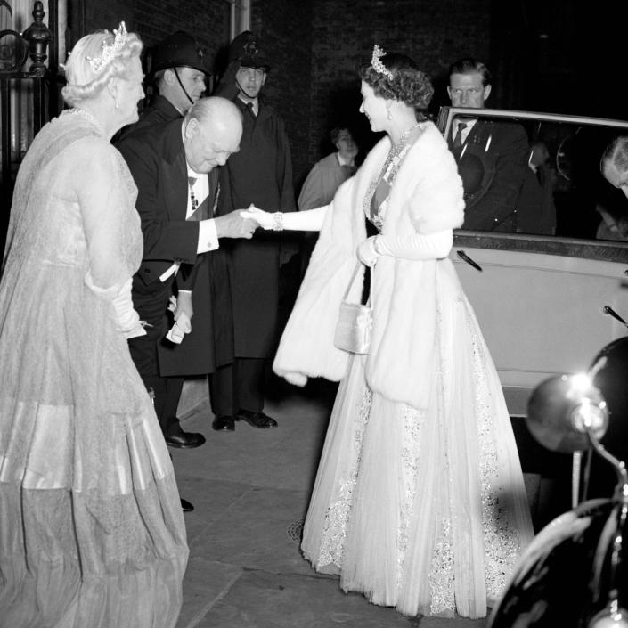File photo dated 05/04/1955 of Prime Minister Sir Winston Churchill bowing to Queen Elizabeth II as he welcomes her and the Duke of Edinburgh to 10 Downing Street for dinner as the Queen turns 90 on the April 21st.