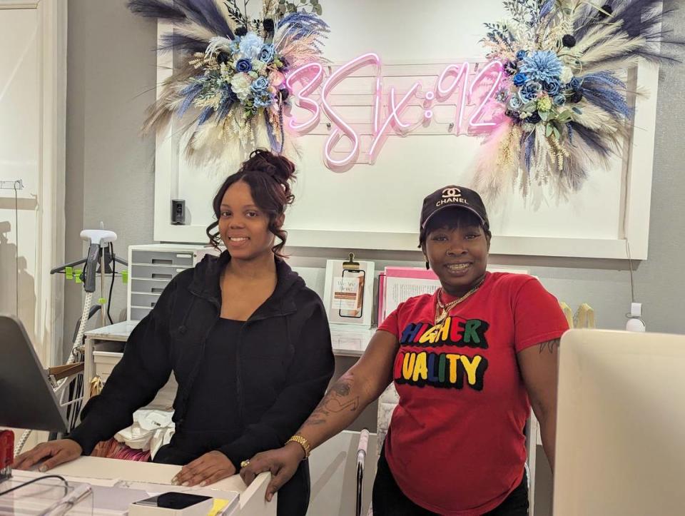 Jasmine Wright, left, owner of 3Six92, stands behind the register with employee Nikki Biggers. The store opened in August at Northlake Mall in Charlotte.