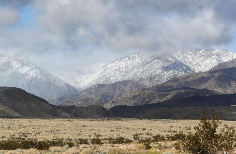 The snow-capped San Bernardino Mountains can be seen near Highway 62 west of Desert Hot Springs on Sunday.