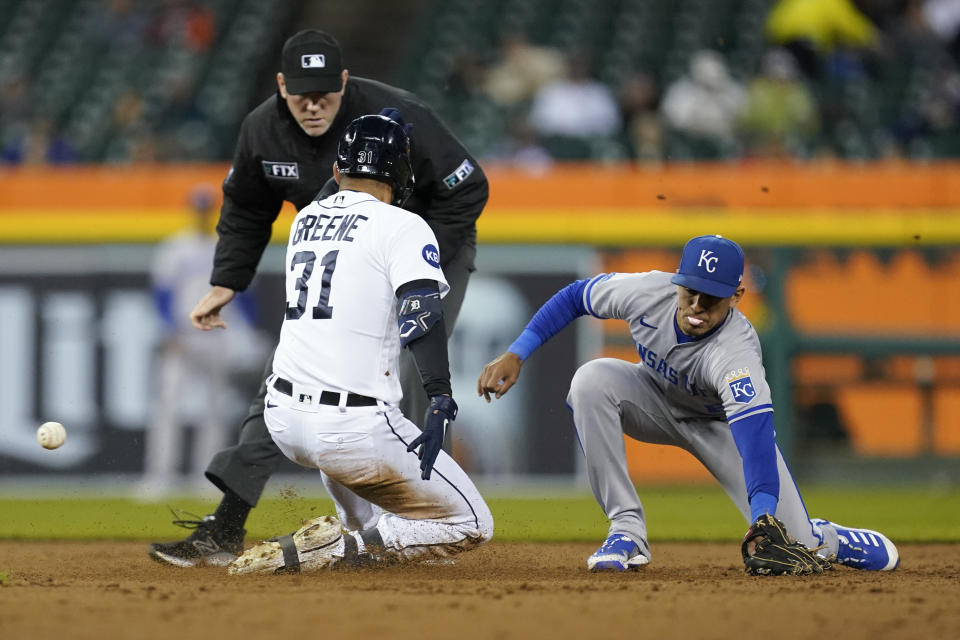 Detroit Tigers center fielder Riley Greene (31) slides safely into second base as Kansas City Royals second baseman Nicky Lopez (8) can't make the catch in the third inning of a baseball game in Detroit, Wednesday, Sept. 28, 2022. (AP Photo/Paul Sancya)