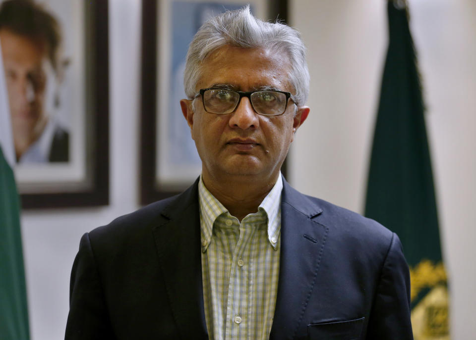 Pakistan's top health official Faisal Sultan poses for photograph at his office in Islamabad, Pakistan, Monday, May 24, 2021. Sultan who is overseeing the country's response to coronavirus said Monday the new COVID-19 variant that devastated neighboring India by causing record infections and deaths had not been found in Pakistan yet. (AP Photo/Anjum Naveed)