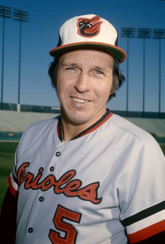 <p>Focus on Sport/Getty</p> Brooks Robinson poses before a MLB game