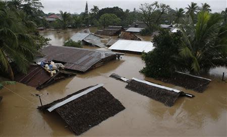 View of houses submerged in heavy flooding brought by tropical depression "Agaton", in Butuan on the southern Philippine island of Mindanao January 21, 2014. REUTERS/Erik De Castro