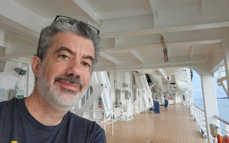 Travel agent Walter Biscardi (pictured here on the Oceania Sirena) prefers a floating office