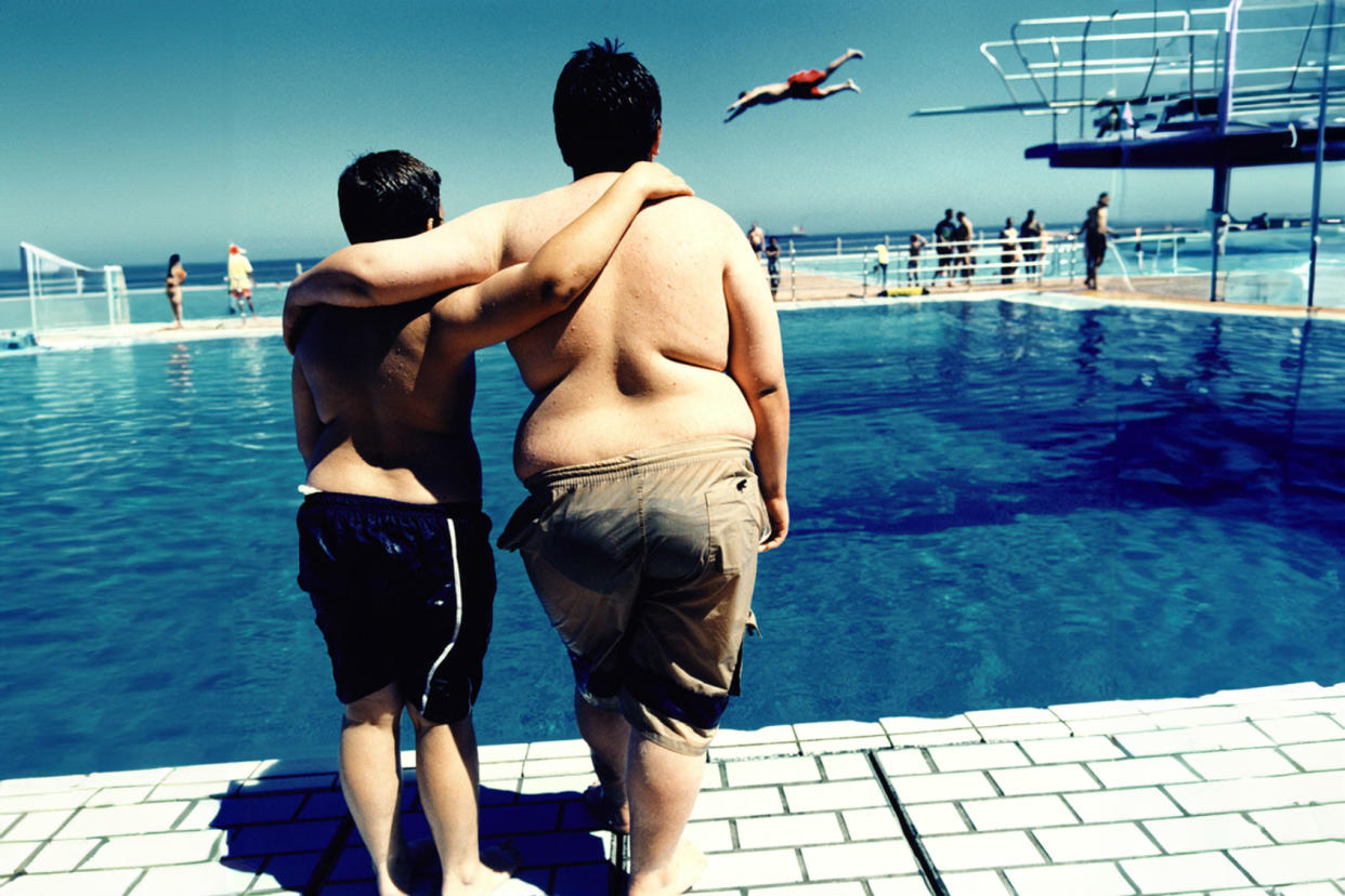 Teen brothers at the pool Getty Images/Karan Kapoor