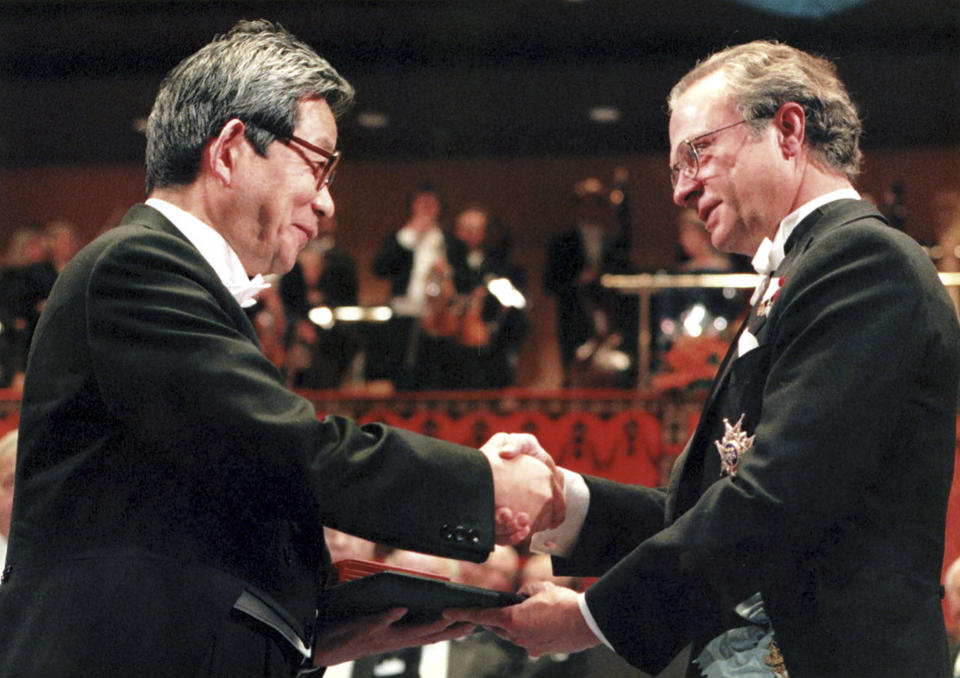 FILE - Japanese Kenzaburo Oe, left, receives the Nobel Prize for Literature from Swedish King Carl XVI Gustaf, right, at the Concert Hall in Stockholm Sweden, Dec. 10, 1994. Japanese publisher Kodansha Ltd. said Monday, March 13, 2023 that Nobel literature laureate Kenzaburo Oe died of old age. Oe's darkly poetic novels were built from a childhood during Japan’s postwar occupation and parenthood with a disabled son. (AP Photo/Gunnar Ask, File)