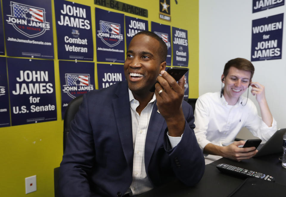 Republican U.S. Senate candidate John James makes a campaign call at his headquarters in Livonia, Mich., Monday, Aug. 6, 2018. (AP Photo/Paul Sancya)