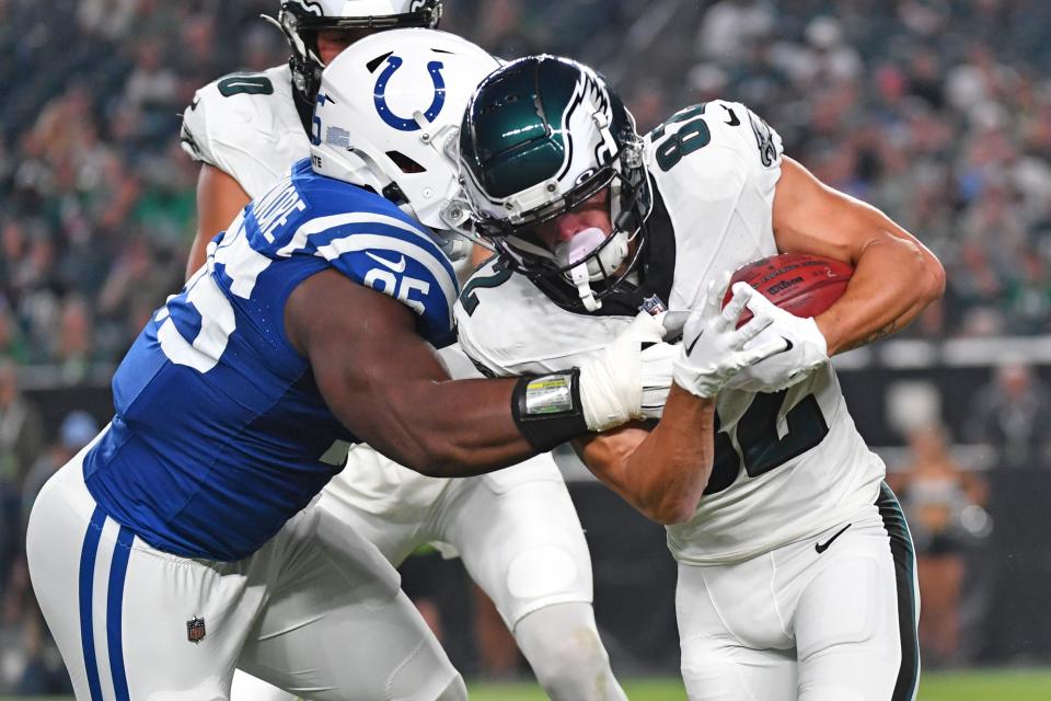 Philadelphia Eagles wide receiver Devon Allen (82) slips a tackle by Indianapolis Colts defensive end Adetomiwa Adebawore (95) as he returns the kick-off during the first quarter at Lincoln Financial Field.