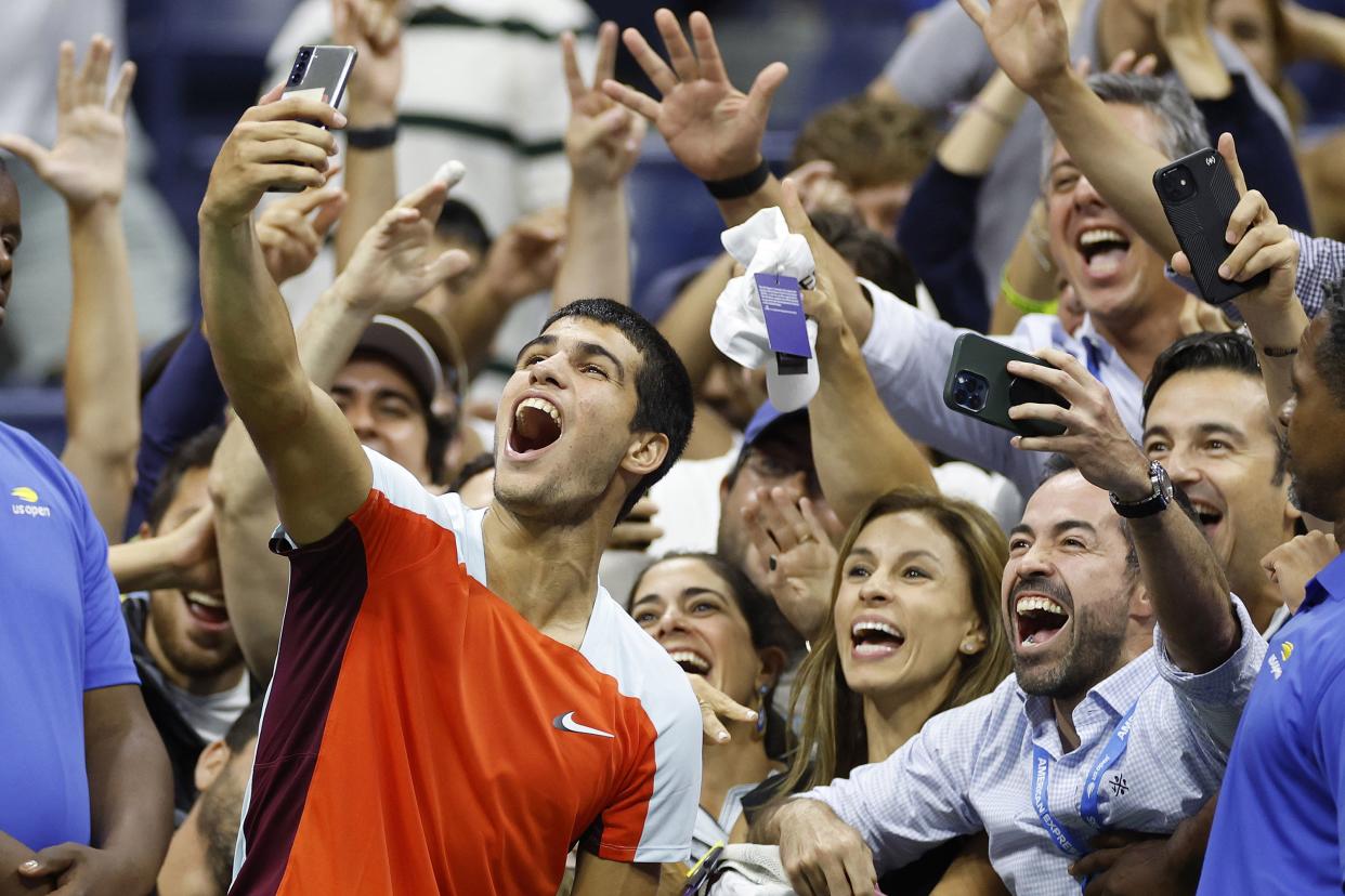 Carlos Alcaraz of Spain celebrates match point with fans against Marin Cilic of Croatia during their Men’s Singles Fourth Round match on Day Eight of the 2022 U.S. Open at USTA Billie Jean King National Tennis Center on Sept. 5, 2022, in Flushing, Queens.
