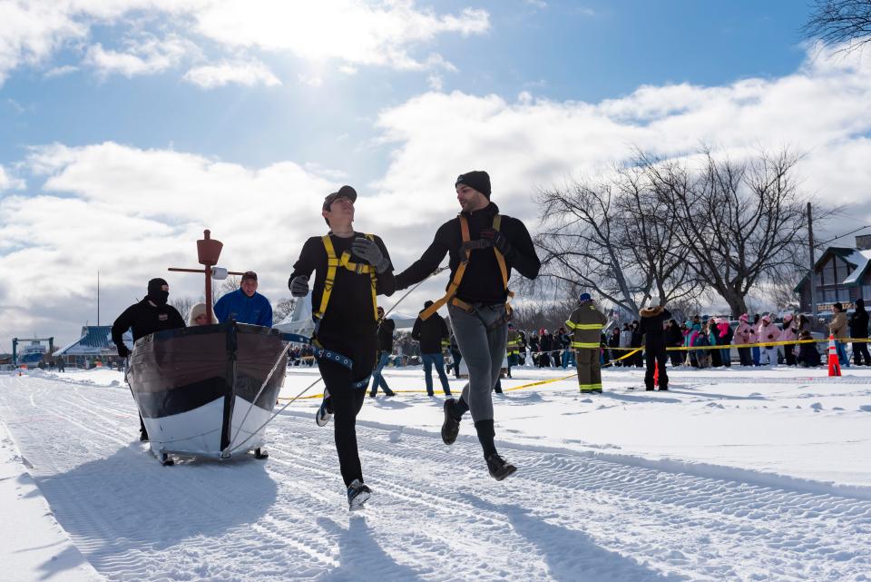 Team "The Welcome" races in the annual Outhouse Races as part of the Mackinaw City Winterfest in the Shepler's Ferry parking lot on Saturday, Jan. 20, 2024.