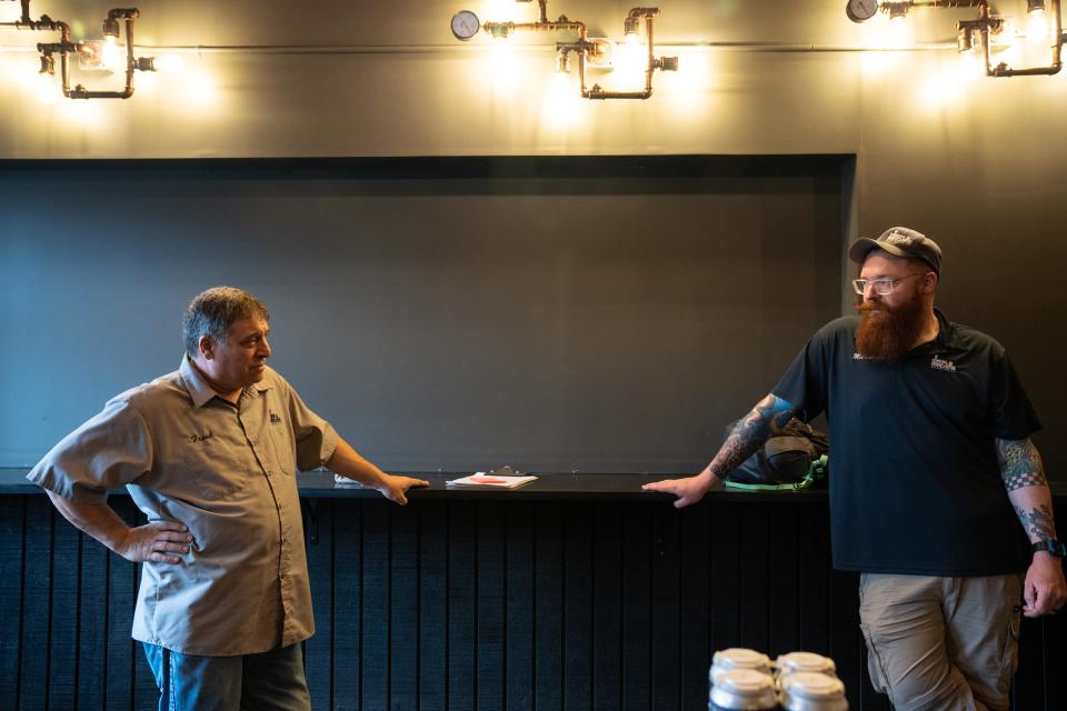 Frank Trotti (left) talks with Marshall Norris on March 21, 2023, at Simple Machine Brewery in Glendale, Ariz.