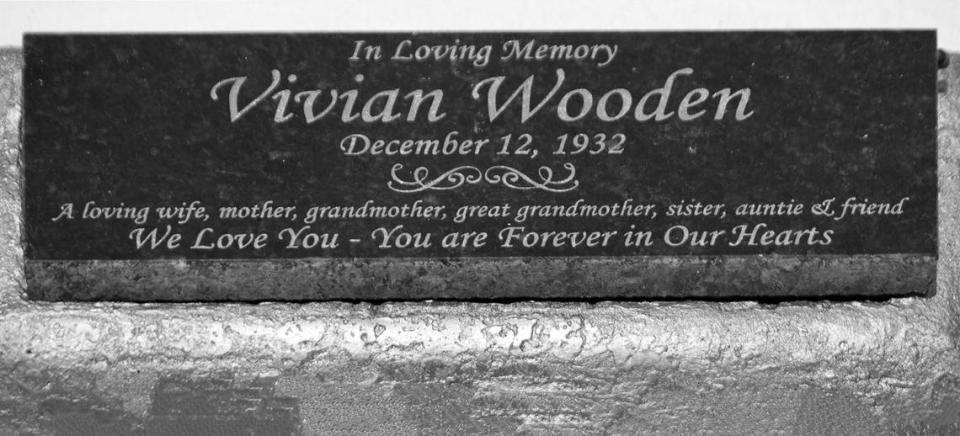 “A loving wife, mother, grandmother, great-grandmother, sister, auntie & friend. We love you- you’re forever in our hearts,” reads the plaque that marks Jessie Wooden’s mother’s grave.