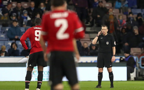 Kevin Friend consults the video assistant referee after Juan Mata scored a goal - Credit: PA