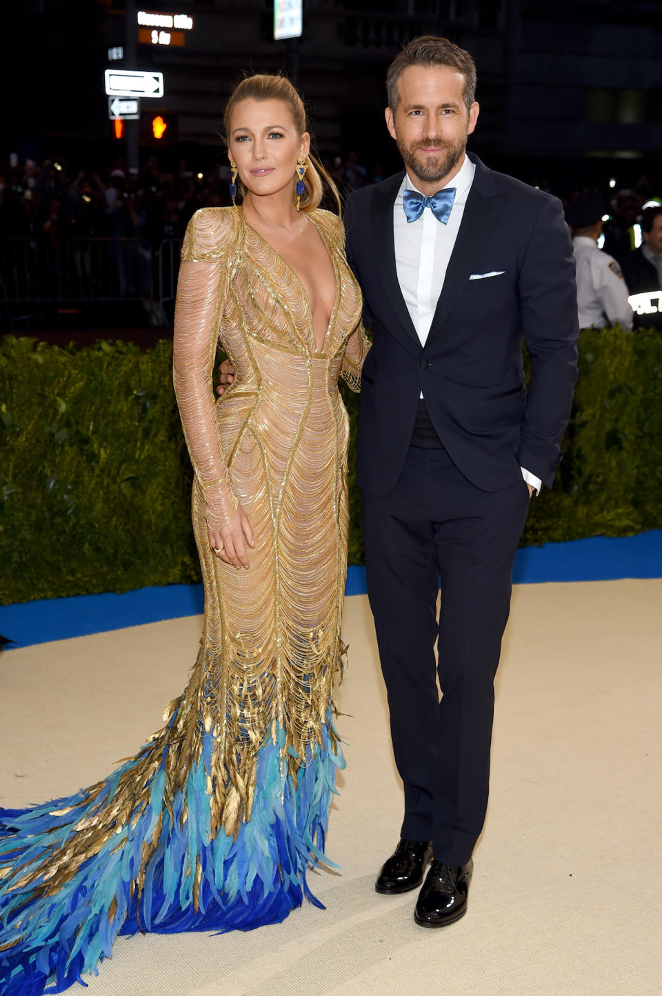 <p>Ryan Reynolds’s bowtie matched the feather train of his wife’s incredible Versace gown. (Photo by Dimitrios Kambouris/Getty Images) </p>