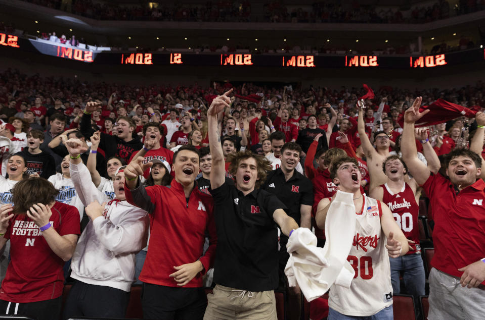 Nebraska fans cheer as their team takes the lead against Wisconsin during the second half of an NCAA college basketball game Thursday, Feb. 1, 2024, in Lincoln, Neb. Nebraska defeated Wisconsin 80-72 in overtime. (AP Photo/Rebecca S. Gratz)