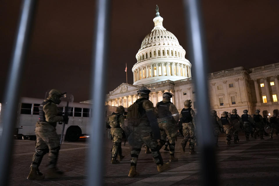 Members of the National Guard arrive to secure the area outside the U.S. Capitol, Wednesday, Jan. 6, 2021, in Washington. (AP Photo/Jacquelyn Martin)