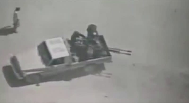 Video grab of people believed to be militants on a pickup truck with a gun in Afghanistan