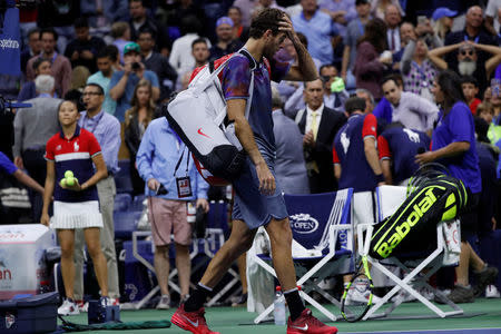 Tennis - US Open - Semifinals - New York, U.S. - September 8, 2017 - Juan Martin del Potro of Argentina walks off court after loss to Rafael Nadal of Spain. REUTERS/Mike Segar