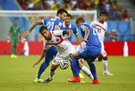 Costa Rica's Bryan Ruiz (C) fights for the ball with Greece's Jose Holebas (2nd R) during their 2014 World Cup round of 16 game at the Pernambuco arena in Recife June 29, 2014. REUTERS/Tony Gentile