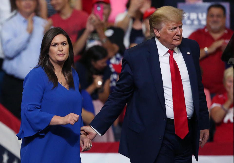 President Trump leads Sarah Huckabee Sanders to the podium during his reelection kickoff campaign rally at the Amway Center in Orlando, Fla., on Tuesday, June 18, 2019. (Stephen M. Dowell/Orlando Sentinel/Tribune News Service via Getty Images)