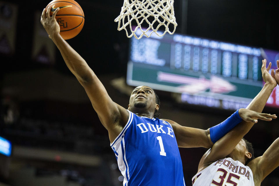 Duke guard Trevor Keels (1) holds off Florida State guard Matthew Cleveland (35) as he goes in for a lay up in the first half of an NCAA college basketball game in Tallahassee, Fla., Tuesday Jan. 18, 2022. (AP Photo/Mark Wallheiser)