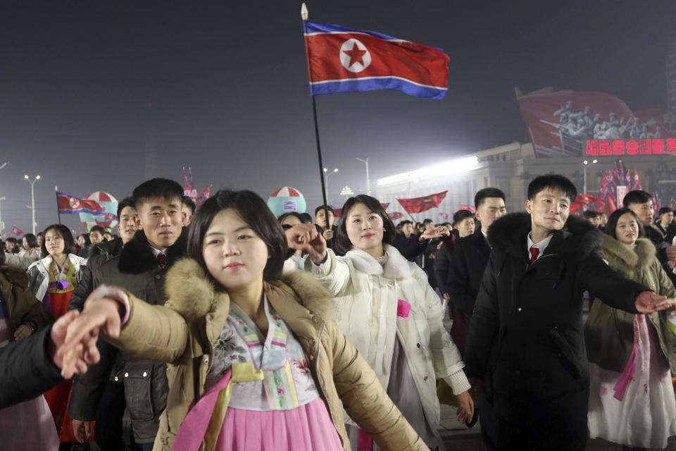 People attend the New Year's eve gala of youth and students at Kim Il Sung Square in Pyongyang, North Korea Sunday, Dec. 31, 2023. (AP Photo/Jon Chol Jin)