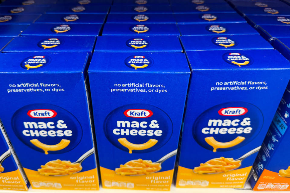 Shelves stocked with boxes of Kraft Mac & Cheese