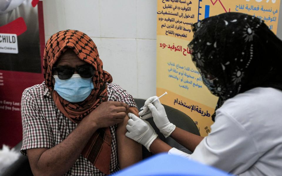 A man receives a dose of the Oxford-AstraZeneca vaccine at the Jabra Hospital in Sudan's capital Khartoum - AFP