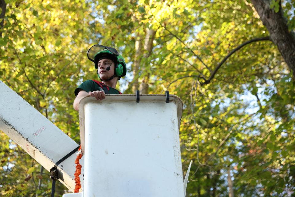 Andrew Hughes used savings from summer work to purchase a bucket truck for Urban Loggers.