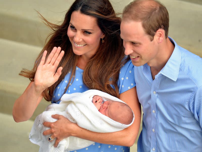 FILE PHOTO: Britain's Catherine, Duchess of Cambridge, holds her baby son outside the Lindo Wing of St Mary's Hospital before leaving with Prince William, in central London