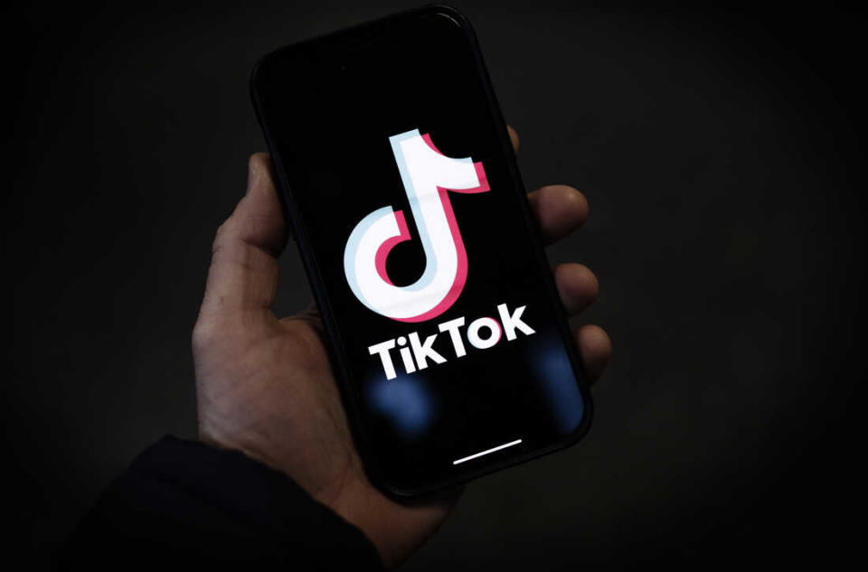 LONDON, ENGLAND - FEBRUARY 28: In this photo illustration, a TikTok logo is displayed on an iPhone on February 28, 2023 in London, England. This week, the US government and European Union's parliament have announced bans on installing the popular social media app on staff devices. (Photo by Dan Kitwood/Getty Images)