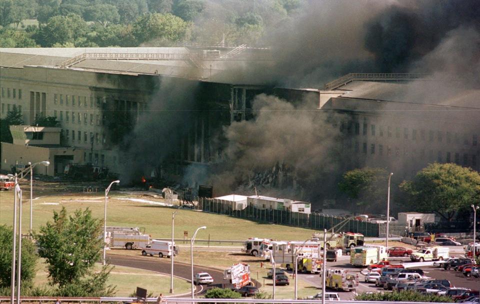 FILE - In this Sept. 11, 2001 file photo, the south side of the Pentagon burns after a plane crash in Washington. Newly released Pentagon documents show that Air Force officers debated briefly about burial at sea before concluding that 1,321 unidentifiable fragments of remains from the 9/11 attack on the Pentagon should be treated as medical waste and incinerated.