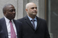 Craig Carton, right, the former co-host of a sports radio show with ex-NFL quarterback Boomer Esiason, arrives at federal court to be sentenced for defrauding investors in a ticket reselling business, Friday, April 5, 2019, in New York. (AP Photo/Mark Lennihan)