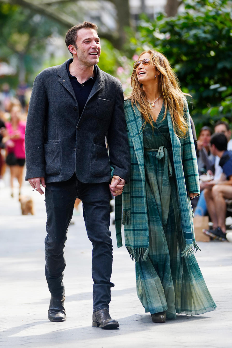<p>Ben Affleck and Jennifer Lopez look like a scene from a rom-com on Sept. 26 while strolling hand-in-hand through New York City.</p>