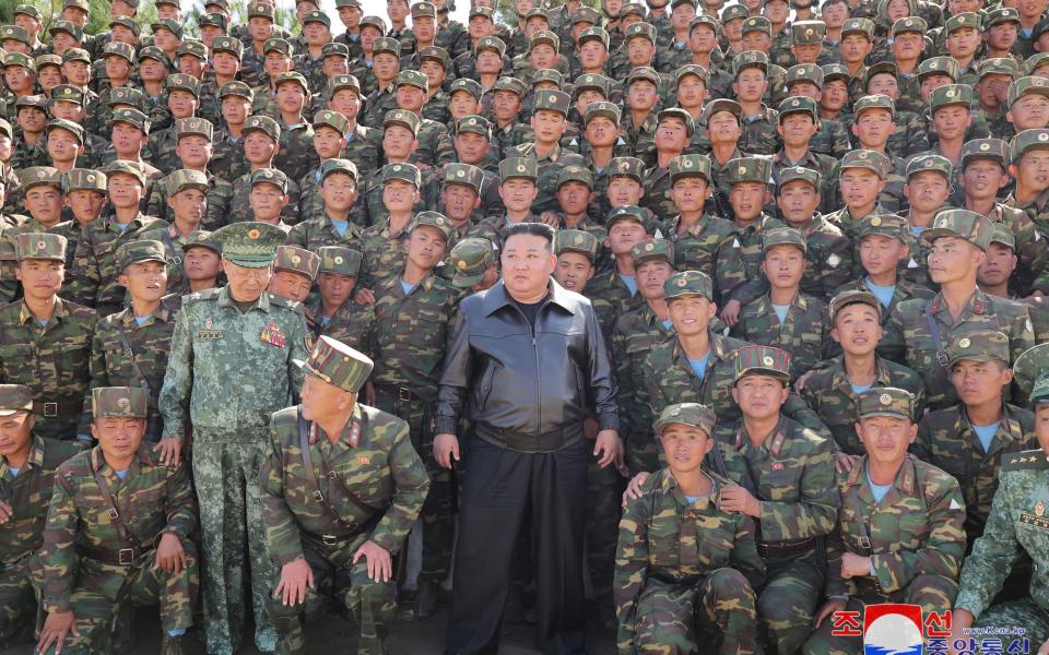 Kim Jong-Un, posing with North Korean soldiers