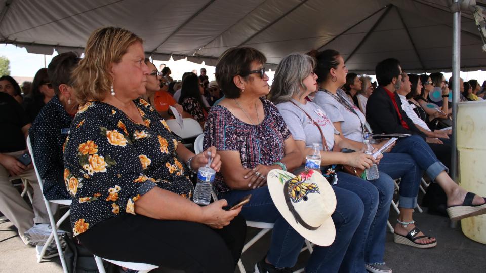 Community members attending a ribbon-cutting for Casa de Peregrinos’ new food pantry listen to a line-up of speakers on Friday, Aug. 11, 2023 in the parking lot of the facility, 999 W. Amador Ave., Bldg. 1, Las Cruces.