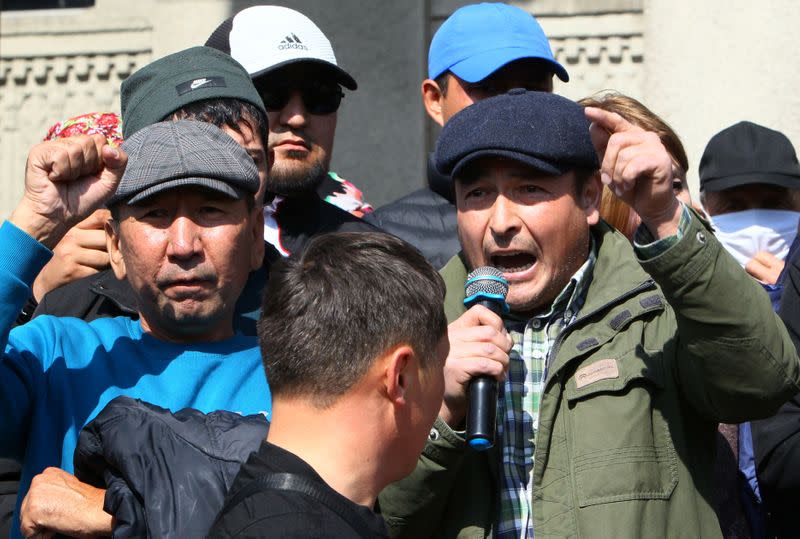 People attend a rally to demand the resignation of Kyrgyzstan's President Sooronbai Jeenbekov in Biskek