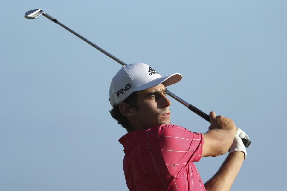 Joaquin Niemann, of Chile, follows his shot off the 17th tee during the third round at the Sony Open golf tournament Saturday, Jan. 16, 2021, in Honolulu. (AP Photo/Marco Garcia)