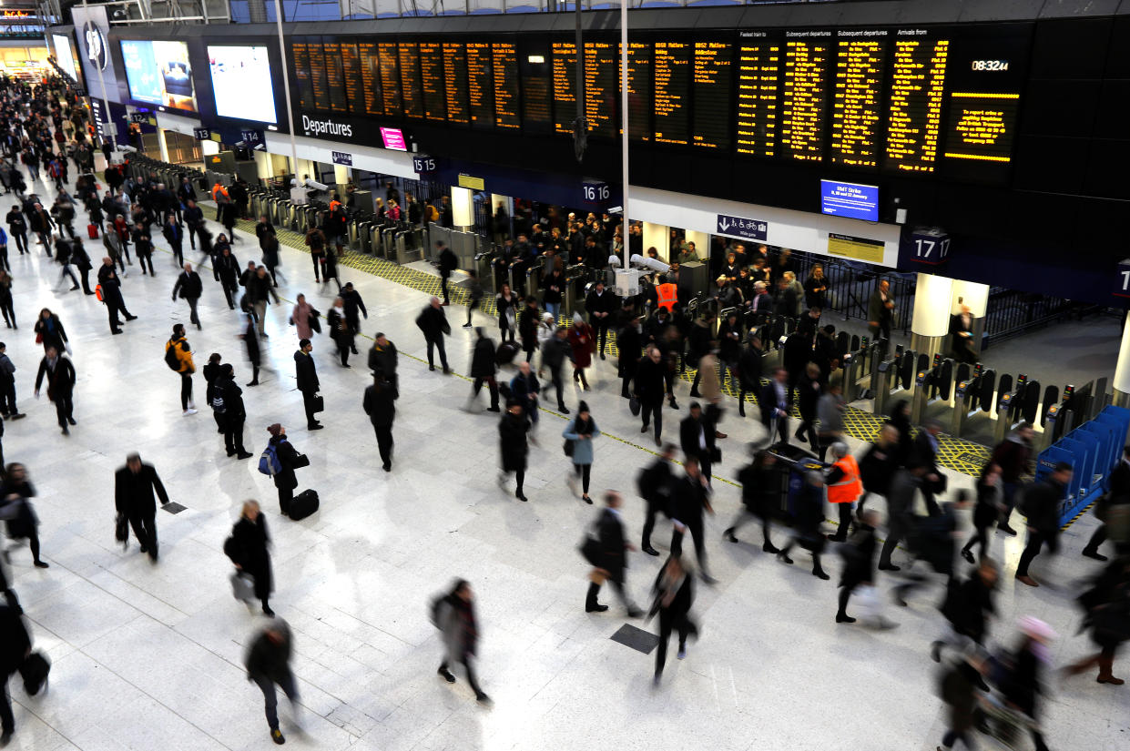 Passengers walk around the concourse at Waterloo Station in London. UK inflation currently stands at 7%