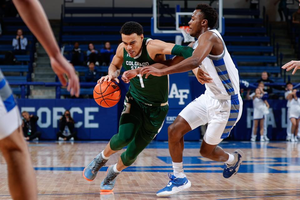 Feb 7, 2023; Colorado Springs, Colorado, USA; Colorado State Rams guard John Tonje (1) drives to the net against Air Force Falcons guard Ethan Taylor (5) in the first half at Clune Arena. Mandatory Credit: Isaiah J. Downing-USA TODAY Sports