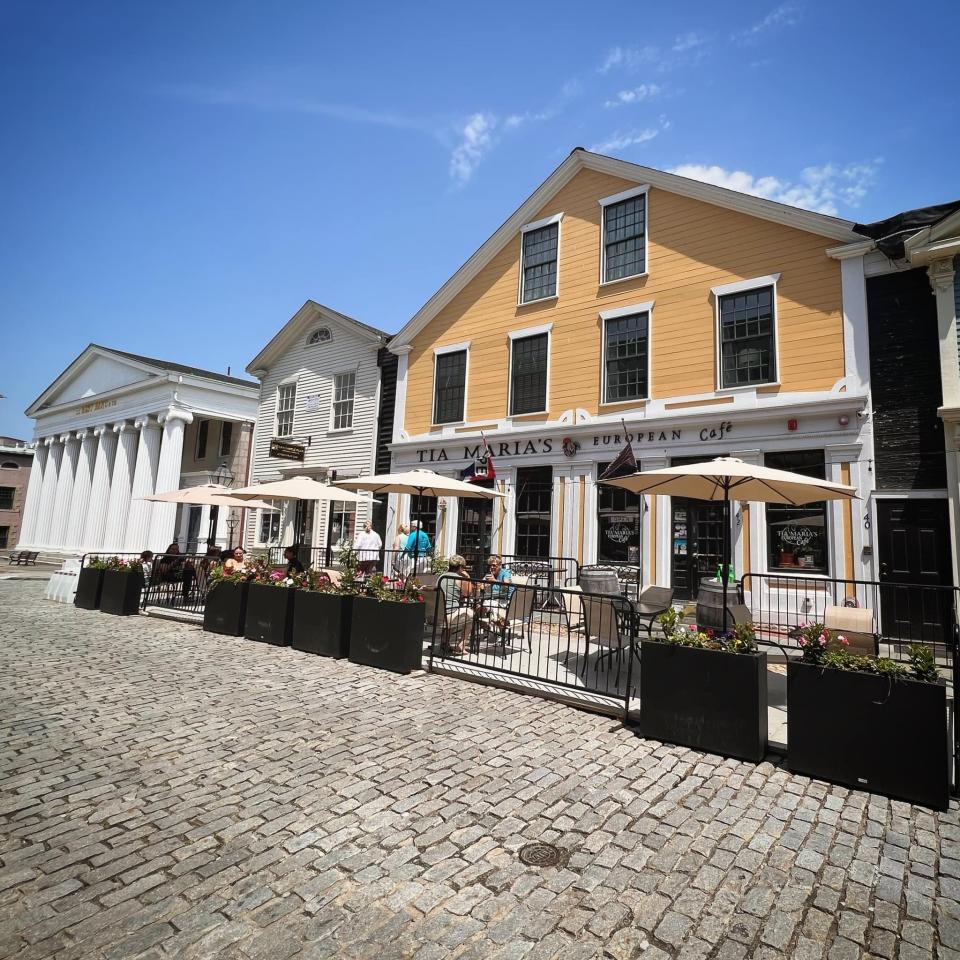 Tia Maria's European Cafe has outdoor dining along the cobblestone street.