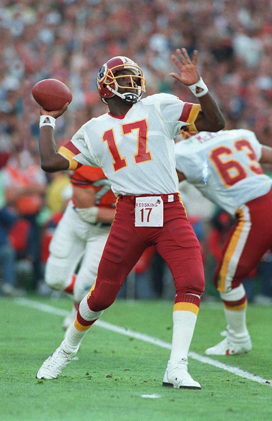 Doug Williams threw for four touchdowns in the second quarter as the Washington Redskins beat the Denver Broncos, 42-10, in Super Bowl XXII in San Diego.