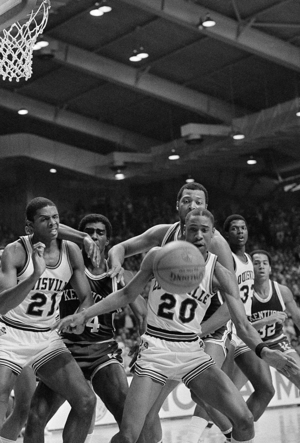 Louisville's Milt Wagner blocks out Kentucky's Melvin Turpin as they go for a free ball in the first half of the NCAA Mideast Regional Championship game at the Stokely Athletics Center in Knoxville, Tenn., on March 26, 1983. 