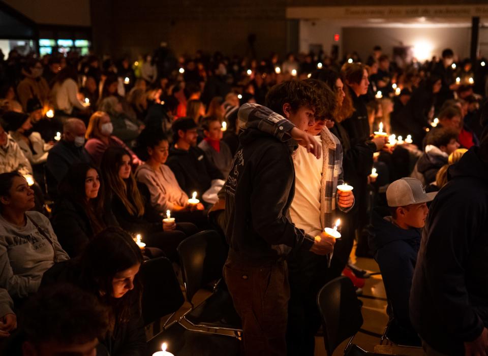 Oxford High School students who were present during the school shooting stand during a prayer vigil at LakePoint Community Church in Oxford following an active shooter situation at Oxford High School in Oxford on November 30, 2021. Police took a suspected shooter into custody and there were multiple victims, the Oakland County Sheriff's office said.