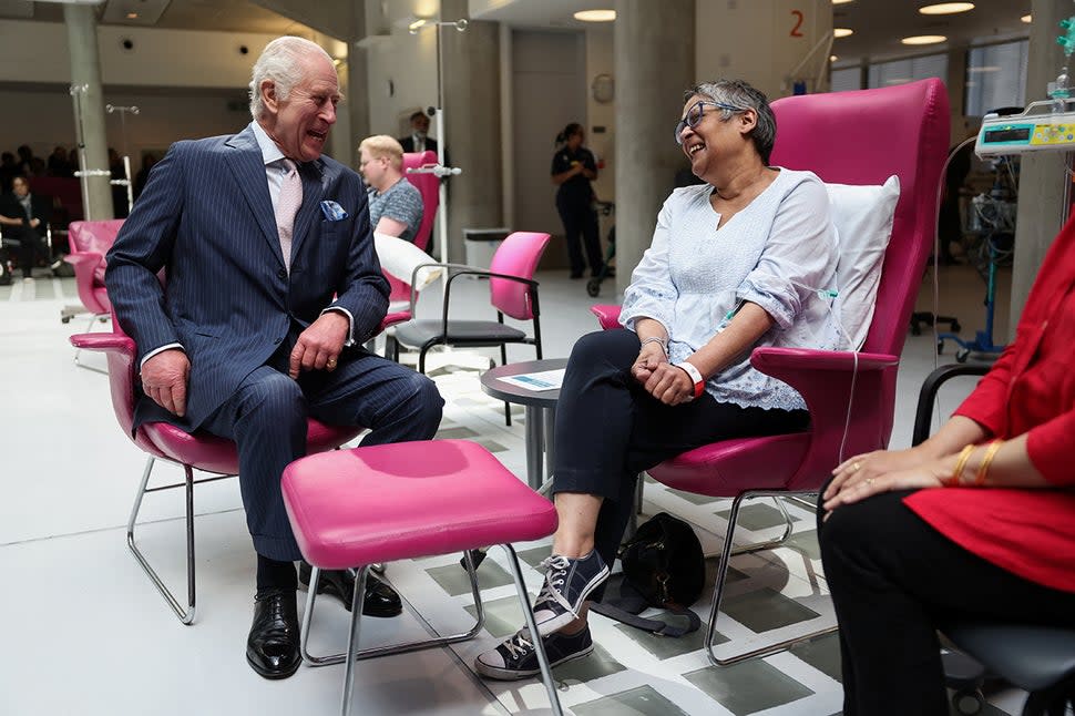 King Charles III meets with patient Asha Millan during a visit at the University College Hospital Macmillan Cancer Centre on April 30, 2024 in London, England. 