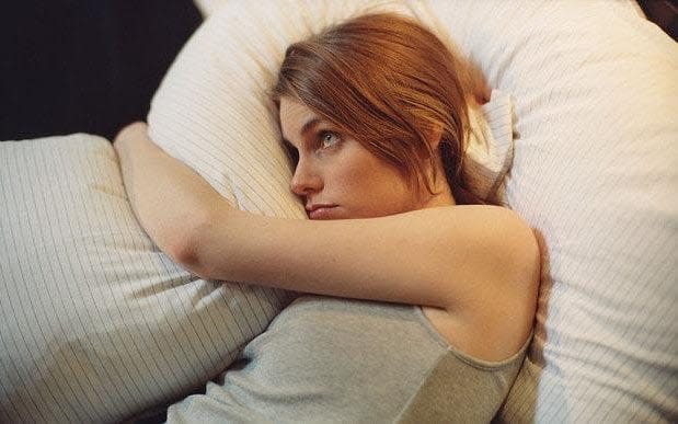 A woman struggles to sleep - Credit: Alamy 