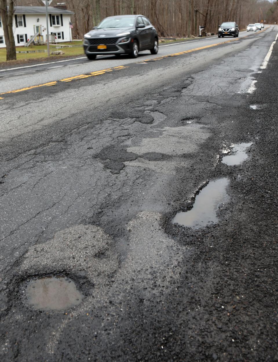 Potholes along Route 312 in the town of Southeast March 7, 2024.